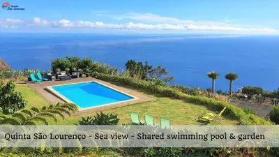 a villa with a swimming pool and a view of the ocean at Quinta São Lourenço in Fajã da Ovelha