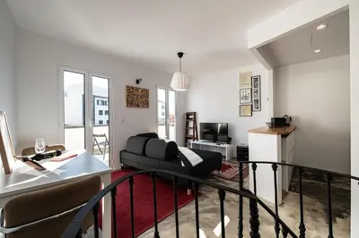 a living room with a couch and a table at Casa do Luar - By WeHost in Funchal