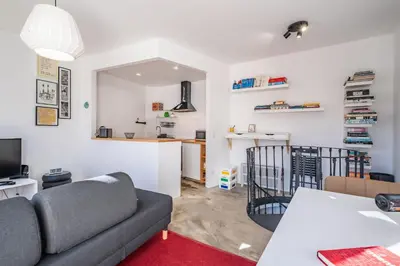 a living room with a couch and a table at Casa do Luar - By WeHost in Funchal