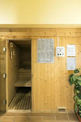 a sauna in a building with signs on the wall at Village Cabo Girao in Câmara de Lobos