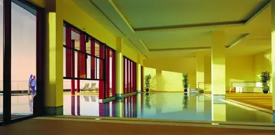 a room with a pool in the middle of a building at Village Cabo Girao in Câmara de Lobos