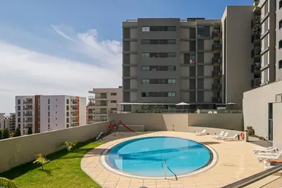 a swimming pool on the roof of a building at Piornais Residence I by An Island Apart in Funchal