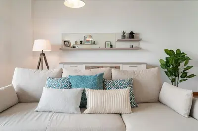 a white couch with pillows on it in a living room at Piornais Residence I by An Island Apart in Funchal