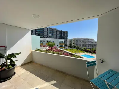 a balcony with a view of a city at Pool view apartment in Funchal