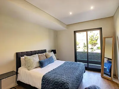 a bedroom with a bed and a large window at Villa Bahari by LovelyStay in Caniçal