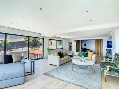 a living room with couches and a table at Villa Bahari by LovelyStay in Caniçal