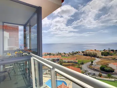 a balcony with a view of the ocean at Heaven I by LovelyStay in Caniço