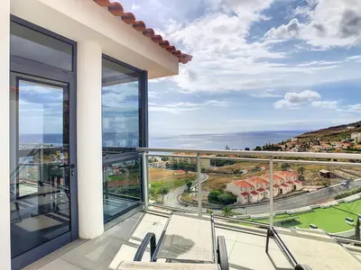a balcony with a view of the ocean at Heaven I by LovelyStay in Caniço