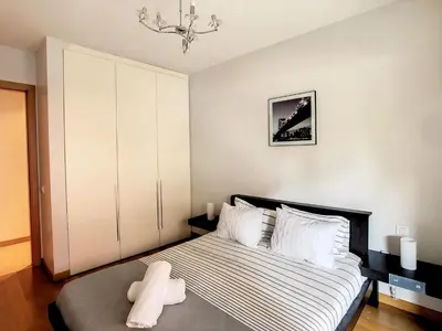 a bedroom with a large bed with white pillows at Samya Apartment by LovelyStay in Funchal