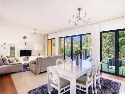 a living room with a white table and chairs at Samya Apartment by LovelyStay in Funchal