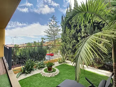 a backyard with a garden with grass and plants at Samya Apartment by LovelyStay in Funchal