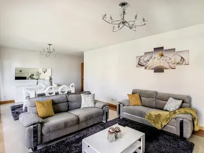 a living room with two couches and a table at Samya Apartment by LovelyStay in Funchal