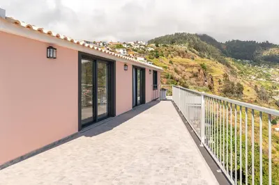 a balcony with a view of a mountain at Casa Raimunda, Big apartment with amazing views in Arco da Calheta