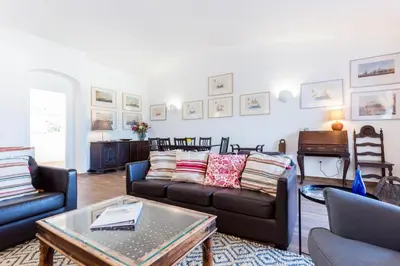 a living room with couches and a table at CoolHouses Algarve Luz, 3 Bed Townhouse w/ beautiful sea view, Luz Bay 76 in Luz
