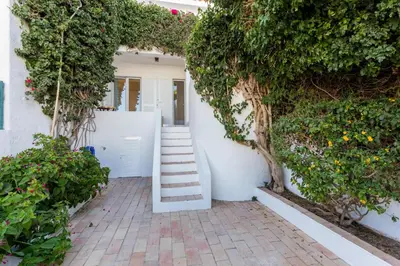 two beds in a room with white walls at CoolHouses Algarve Luz, 3 Bed Townhouse w/ beautiful sea view, Luz Bay 76 in Luz