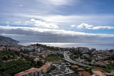 arial view of a city with a road and buildings at City View Apartment by Homie in Funchal