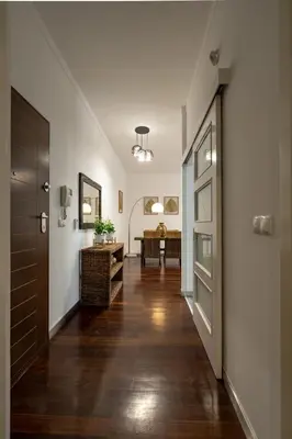 a hallway with a door and a room with a table at City View Apartment by Homie in Funchal