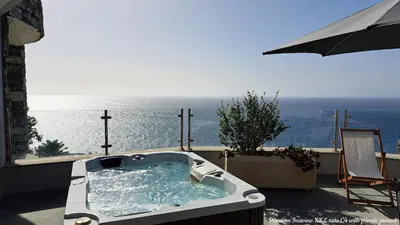 a bath tub with a view of the ocean at Castelo do Mar, Madeira in Tábua