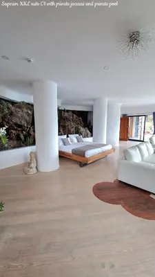a living room with two beds and a couch at Castelo do Mar, Madeira in Tábua