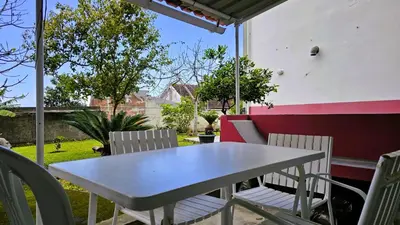a table and chairs sitting on a patio at Casa do Seixal in Seixal