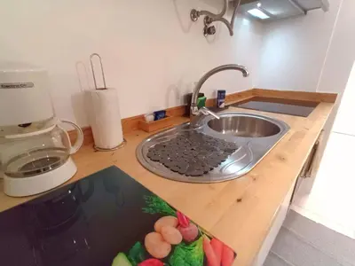 a kitchen counter with a sink and a mixer at Panoramic View Apartment in Funchal