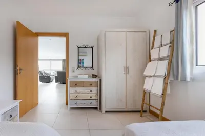 a balcony with a view of the ocean at Villa Acacia in Arco da Calheta