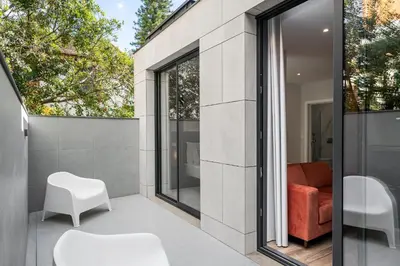 a room with sliding glass doors leading to a patio at Monumental Plaza by Petit Hotels in Funchal