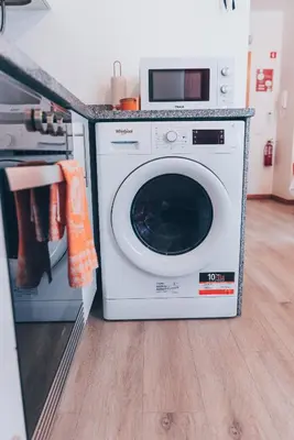 a white washer and dryer sitting in a kitchen at Atlantic Studios #03 in Funchal
