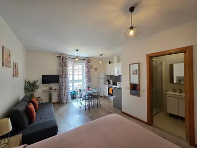 a small living room with a couch and a table at Atlantic Studios #03 in Funchal