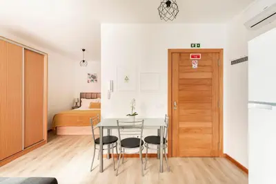 a bedroom with a bed with a yellow blanket and a mirror at Atlantic Studios #02 in Funchal