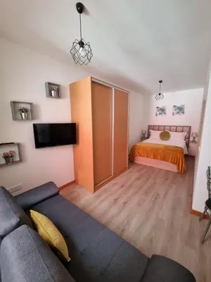 a living room with a bed and a couch at Atlantic Studios #02 in Funchal