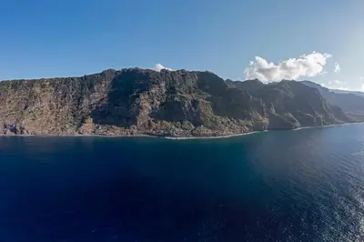 an island in the middle of a body of water at Casa da Rocha de Baixo by An Island Apart in Santana