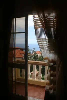 a view of a balcony from a window at Charm Penthouse Ocean View in Calheta