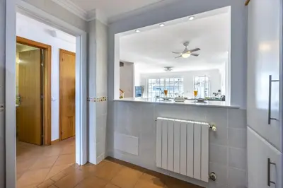 a bathroom with a mirror and a radiator at CoolHouses Luz, Lovely 3 Bed Townhouse & sea views, Casa Baía da Vida in Luz