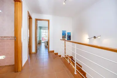 a hallway with a walk in shower and a tile floor at CoolHouses Luz, Lovely 3 Bed Townhouse & sea views, Casa Baía da Vida in Luz