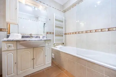 a hotel room with two beds with towels on them at CoolHouses Luz, Lovely 3 Bed Townhouse & sea views, Casa Baía da Vida in Luz