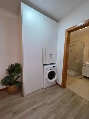a laundry room with a washer and a washing machine at Atlantic Studios #01 in Funchal