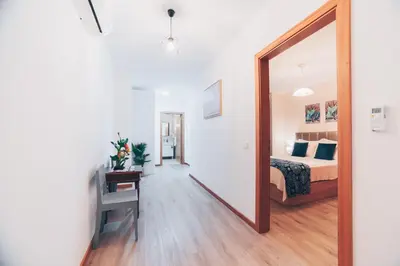 a bedroom with a bed and a mirror at Atlantic Studios #01 in Funchal