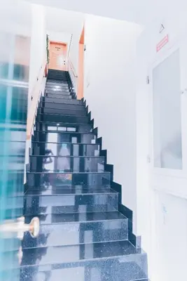 a staircase in a building with a person walking down it at Atlantic Studios #01 in Funchal