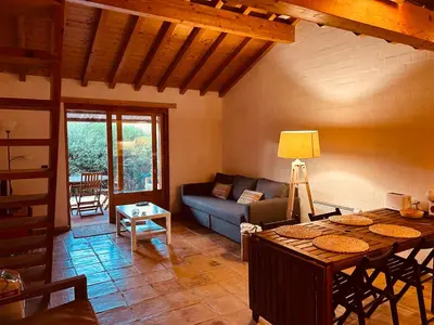 a living room with a couch and a table at Casinha da Praia in Carrapateira
