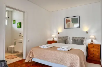 a bedroom with a bed with two towels on it at Blue View, a Home in Madeira in Funchal