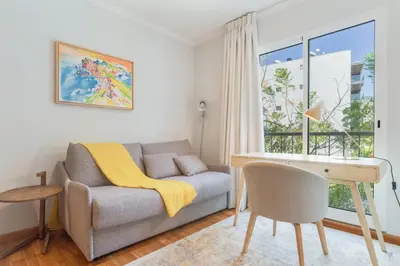 a living room with a couch and a desk at Elena Apartment by Atlantic Holiday in Funchal