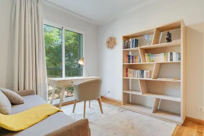 a living room with a desk and a window at Elena Apartment by Atlantic Holiday in Funchal