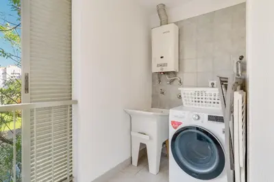 a laundry room with a washer and dryer at Elena Apartment by Atlantic Holiday in Funchal