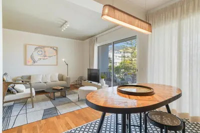 a living room with a table and a couch at Elena Apartment by Atlantic Holiday in Funchal