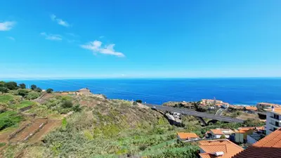 a view of the ocean from above a city at The Atlantic Lookout by LovelyStay in Caniço