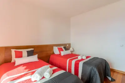 two beds sitting next to each other in a room at Ocean View Tabua by Holiday Rental Madeira in Ribeira Brava