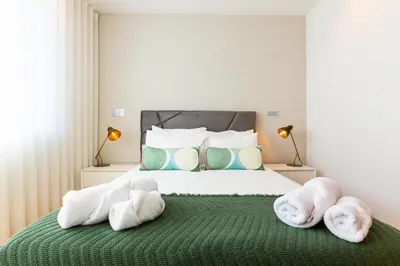 a bedroom with a bed with towels on it at Banana Lodge by Atlantic Holiday in Funchal