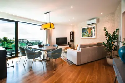 a living room with a table and a couch at Banana Lodge by Atlantic Holiday in Funchal