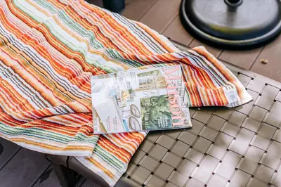 a pile of money sitting on top of a table at La Madérene with Pool by Stay Madeira Island in Tábua